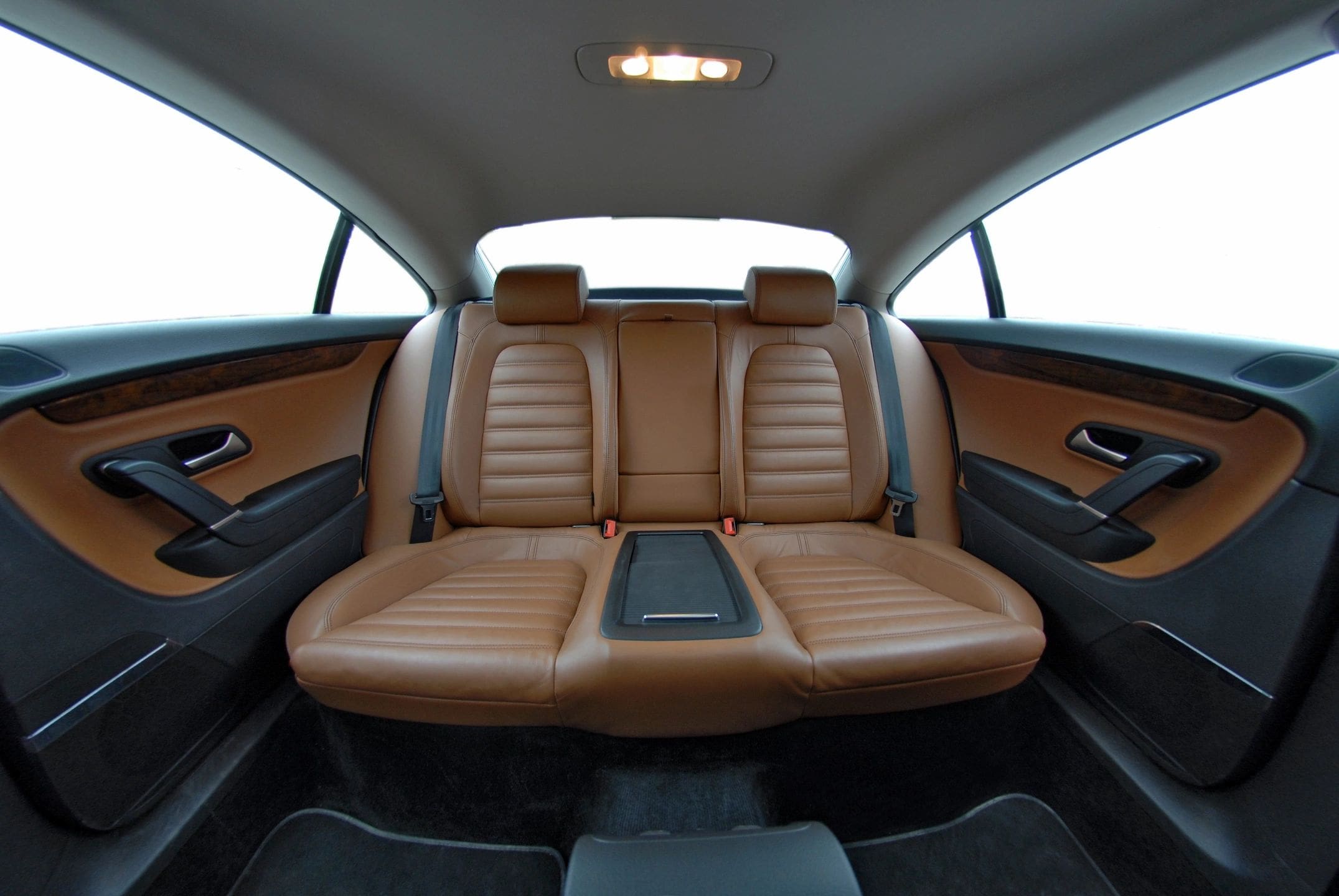 Luxurious brown leather seats in a sleek car interior.